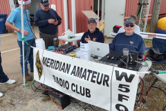 On December 7 the MARC was hosted by the Collinsville Fire & Rescue department at the Collinsville Christmas Market festival where we operated radios under the MARC banner as special event station W5C. HF radios on a long wire off-center fed dipole antenna and a portable HF antenna made over 100 contacts during the festival. This was an effective demonstration of amateur radio in view of the several hundred people present at this event. Pictured from L-R (starting with gentleman in the ARRL cap): Harry, K5BHW - Buford, KI5HCM and Karey, KI5ZLP