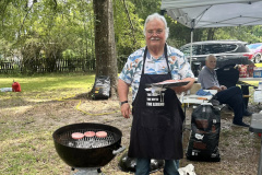 The Mississippi Coast ARA always eats well on Field Day thanks to Chef KI5VKI.  In the photo Tom gets ready to put three more burgers on the grill. (photo provided by the MCARA Splatter)