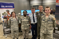 The Vicksburg Squadron of the Civil Air Patrol set up a table at the Capital City Hamfest to demonstrate a flight simulator and to brief Hamfest attendees on the CAP mission and capabilities.  In the photo CAP Cadets stand at parade rest for a photo. (photo provided by AK5J)