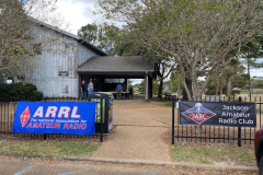 The Jackson Amateur Radio Club hosted the 2025 ARRL Mississippi Day in the Park at the Old Trace Park on the Reservoir in Ridgeland. Greeting the attendees were the ARRL and JARC banners. (photo provided by AC5Z)