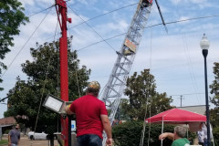 The Olive Branch ARC operated Field Day from City Hall. Wanting to have a big FD signal they put up some serious hardware with their trailer mounted tower and tribander. In the photo WA4CB operates the lift controls, and KH0DW makes sure the tribander elements are not hanging up. (photo provided by K5OLV)