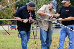 The Pine Belt ARC set up the W0W Special Event Station on the University of Southern Mississippi Campus as part of the USM Powwow Event to celebrate American Indian Heritage.  In the photo KC3HLT, K5TLL, and KX4TXB put the finishing touches on the W0W tribander.  (photo provided by N5CW)